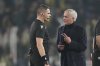 Fenerbahce's head coach Jose Mourinho, right, argues with the referee Simone Sozza at the end of the Europa League opening phase soccer match against Lyon at Sukru Saracoglu stadium in Istanbul, Turkey, Thursday, Jan. 23, 2025. (AP Photo/Francisco Seco)