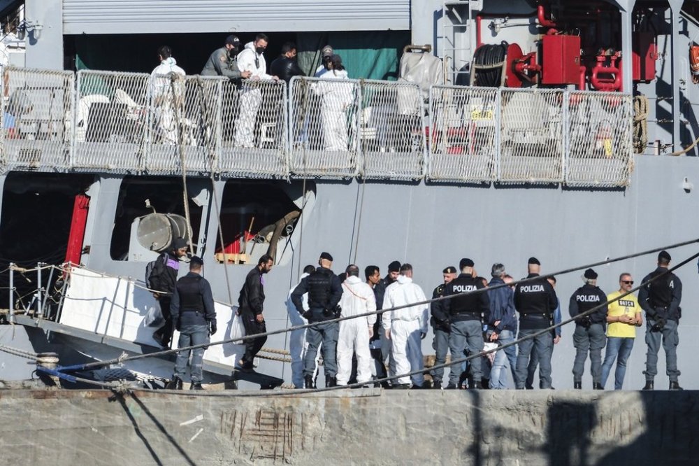 FILE - Migrants disembark from the Italian navy ship Libra at the port of Shengjin, northwestern Albania, Friday, Nov. 8, 2024. (AP Photo/Vlasov Sulajm, File)