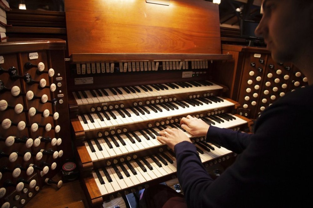 Colin MacKnight, Director of Music at Trinity Episcopal Cathedral in Little Rock, Ark., rehearses, Tuesday, Jan. 21, 2025, for his upcoming lunch-time concert series featuring the works of Johann Sebastian Bach. (AP Photo/Katie Adkins)