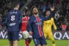 PSG's Marco Asensio, centre, reacts after missing a chance during the French League One soccer match between Paris Saint-Germain and Reims at Parc des Princes stadium in Paris, Saturday, Jan. 25, 2025. (AP Photo/Michel Euler)