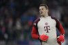 FILE - Bayern's goalkeeper Manuel Neuer stretches himself during warm up before the Champions League opening phase soccer match between FC Bayern and Paris Saint Germain, at the Allianz Arena in Munich, Germany, Tuesday, Nov. 26, 2024. (AP Photo/Matthias Schrader, File)