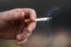 A man holds a lit cigarette while smoking in San Francisco, Dec. 2, 2020. THE CANADIAN PRESS/AP-Jeff Chiu