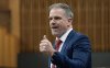Minister of Health Mark Holland rises during Question Period, in Ottawa, Monday, Dec. 2, 2024. THE CANADIAN PRESS/Adrian Wyld