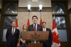 Prime Minister Justin Trudeau addresses media following the imposition of a raft of tariffs by U.S. President Donald Trump against Canada, Mexico and China, in Ottawa, Saturday, Feb. 1, 2025. Minister of Public Safety David McGuinty, left to right, Global Affairs Minister Melanie Joly and Minister of Governmental Affairs Dominic LeBlanc look on. THE CANADIAN PRESS/Justin Tang