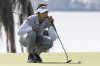 Patty Tavatanakit lines up putt on the 18th green during the first round of the Hilton Grand Vacations Tournament of Champions LPGA golf tournament in Orlando, Fla., Thursday, Jan. 30, 2025. (AP Photo/Kevin Kolczynski)