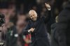 Liverpool's manager Arne Slot smiles at the end of the English Premier League soccer match between Bournemouth and Liverpool at the Vitality stadium in Bournemouth, England, Saturday, Feb. 1, 2025. (AP Photo/Alastair Grant)