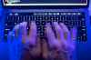 An October cyberattack on Canada's largest public library system that brought down its website and exposed sensitive employee information will keep some services offline into 2024. A man uses a computer keyboard in Toronto, Monday, Oct. 9, 2023 in this photo illustration. THE CANADIAN PRESS/Graeme Roy