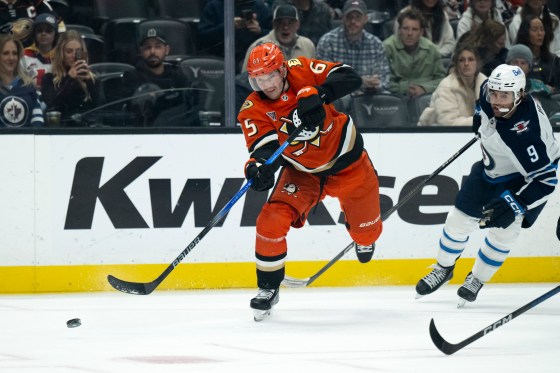 Anaheim Ducks defenceman Jacob Trouba (65) shoots past Winnipeg Jets left wing Alex Iafallo (9) during the Dec. 18 game in Anaheim, Calif. (Kyusung Gong / The Associated Press files)