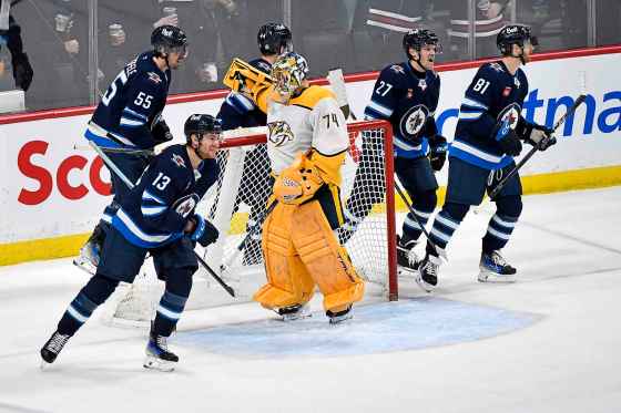 Winnipeg Jets' Gabriel Vilardi (13) skates past Nashville Predators goaltender Juuse Saros (74) after scoring during the Dec. 30 game. The Jets won that game 3-0. (Fred Greenslade/The Canadian Press files)