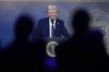 FILE - People follow a virtual speech of President Donald Trump at the annual meeting of the World Economic Forum in Davos, Switzerland, Jan. 23, 2025. (AP Photo/Markus Schreiber, File)
