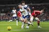 FILE - Tottenham's Radu Dragusin, front, controls the ball during the English League Cup quarter-final soccer match between Tottenham and Manchester United, at the Tottenham Hotspur Stadium in London, Thursday, Dec. 19, 2024. (AP Photo/Dave Shopland, File)