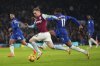 West Ham's Jarrod Bowen, foreground, and Chelsea's Noni Madueke challenge for the ball during the English Premier League soccer match between Chelsea and West Ham United at Stamford Bridge stadium in London, Monday, Feb. 3, 2025. (AP Photo/Kirsty Wigglesworth)