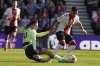 FILE - Southampton's Carlos Alcaraz, right, and Manchester City's Jack Grealish challenge for the ball during the English Premier League soccer match between Southampton and Manchester City at St Mary's Stadium in Southampton, England, on April 8, 2023. (AP Photo/Frank Augstein, File)