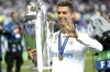 FILE - Real Madrid's Cristiano Ronaldo celebrates with the trophy after winning the Champions League Final soccer match between Real Madrid and Liverpool at the Olimpiyskiy Stadium in Kiev, Ukraine, Saturday, May 26, 2018. (AP Photo/Pavel Golovkin, File)