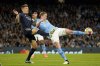 FILE - Manchester City's Kevin De Bruyne kicks the ball with Real Madrid's Toni Kroos during the Champions League quarterfinal second leg soccer match between Manchester City and Real Madrid at the Etihad Stadium in Manchester, England, Wednesday, April 17, 2024. (AP Photo/Dave Thompson, File)