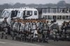 Mexican National Guards prepare to board an aircraft at the International Airport in Merida, Mexico, Tuesday, Feb. 4, 2025, to travel north to reinforce the country's border with the United States. (AP Photo/Martin Zetina)