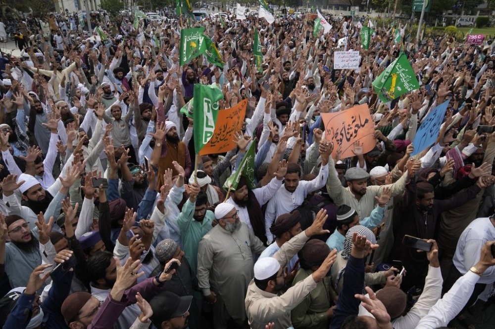 FILE - Supporters of a religious group 'Tehreek-e-Labiak Pakistan' chant slogans during a rally against a woman who recently arrested in the blasphemy charges, in Lahore, Pakistan, April 17, 2023. (AP Photo/K.M. Chaudary, File)