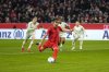 Bayern's Harry Kane, center, on his way to scoring on a penalty to score the first goal of the match during the German Bundesliga soccer match between Bayern Munich and Werder Bremen at the Allianz Arena in Munich, Germany, Friday, Feb. 7, 2025. (AP Photo/Matthias Schrader)