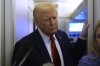 President Donald Trump speaks to reporters aboard Air Force One en route from Miami to Joint Base Andrews, Md., Monday, Jan. 27, 2025. (AP Photo/Mark Schiefelbein)
