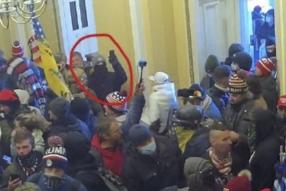 This image provided by District of Columbia Attorney's Office obtained from the U.S. Capitol Police shows Matthew Huttle inside the Capitol building on Jan. 6, 2021 in Washington. (Attorney's Office, District of Columbia via AP)