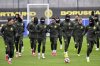 Dortmund players run during a training one day ahead of their Champions League soccer match against FC Bologna, in Dortmund, Germany, Monday Jan. 20, 2025. (Federico Gambarini/dpa/dpa via AP)
