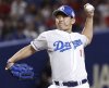 Japan's Chunichi Dragons' pitcher Shinnosuke Ogasawara throws a ball during a game against Hiroshima Toyo Carp in Nagoya, Aichi prefecture, central Japan, on Aug. 28, 2024. (Kyodo News via AP)