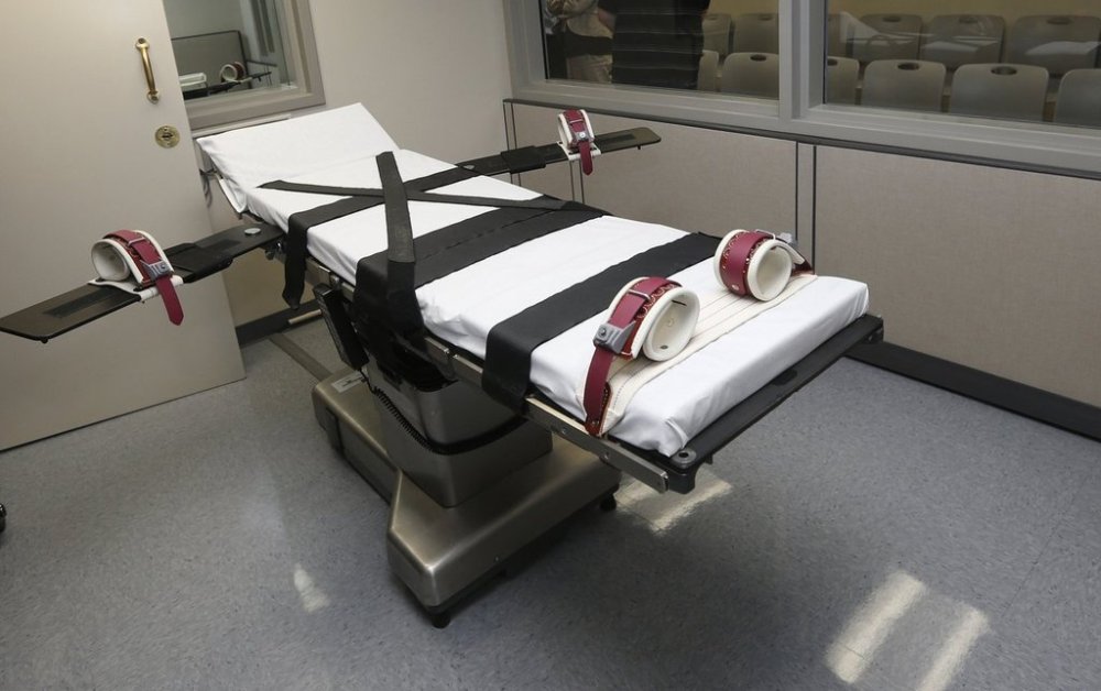 FILE - This photo shows the gurney in the execution chamber at the Oklahoma State Penitentiary in McAlester, Oklahoma, Oct. 9, 2014. (AP Photo/Sue Ogrocki, File)
