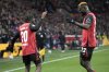 Leverkusen's Jeremie Frimpong, left, celebrates with Leverkusen's Victor Boniface after he scored his side's second goal during the German Bundesliga soccer match between Bayer Leverkusen and TSG Hoffenheim at the BayArena in Leverkusen, Germany, Sunday, Feb. 2, 2025. (AP Photo/Martin Meissner)
