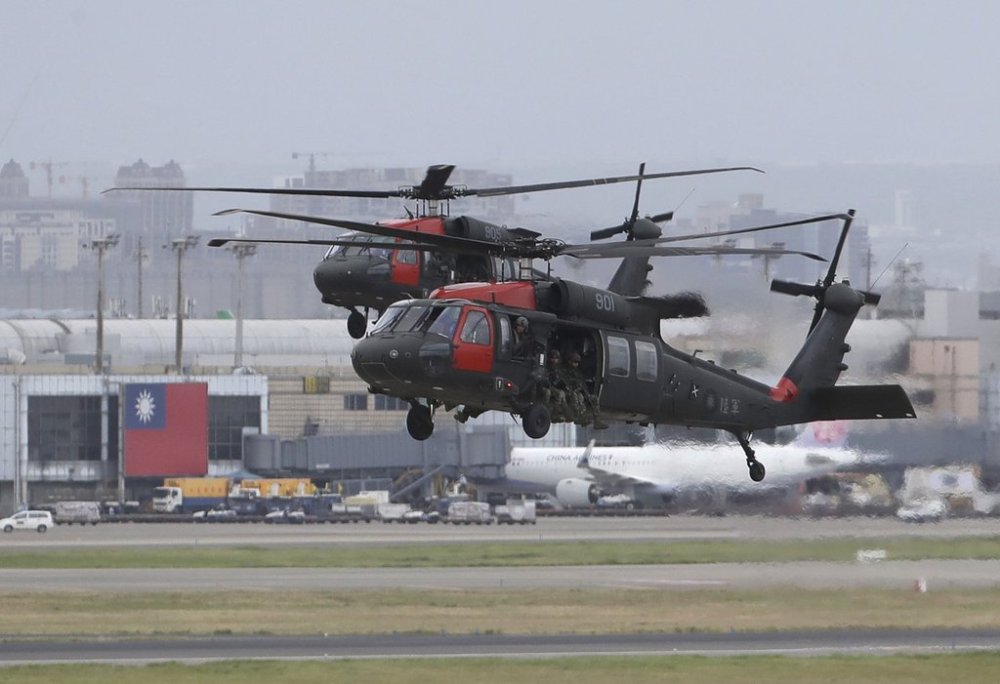 FILE - Two Sikorsky UH-60
