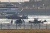 Search and rescue efforts are seen around a wreckage site in the Potomac River from Ronald Reagan Washington National Airport, early Thursday morning, Jan. 30, 2025, in Arlington, Va. (AP Photo/Mark Schiefelbein)