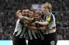 Newcastle's Jacob Murphy, left, celebrates with teammates scoring his side's first goal during the English League Cup soccer match between Newcastle United and Arsenal at St. James' Park stadium in Newcastle, England, Wednesday, Feb. 5, 2025.(AP Photo/Jon Super)