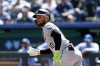 FILE - Chicago White Sox' Yoán Moncada watches his hit to left field for a triple during the first inning of a baseball game against the Kansas City Royals in Kansas City, Mo., April 7, 2024. (AP Photo/Colin E. Braley, File)