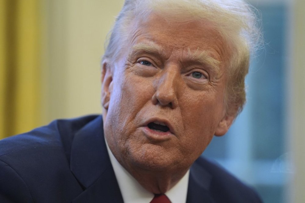 President Donald Trump speaks as he signs executive orders in the Oval Office at the White House, Thursday, Jan. 30, 2025, in Washington. (AP Photo/Evan Vucci)
