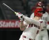 FILE - Los Angeles Angels' Mickey Moniak watches his walkoff home run during the ninth inning of a baseball game against the Seattle Mariners in Anaheim, Calif., Aug. 31, 2024. (AP Photo/Ashley Landis, File)