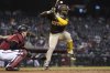 FILE - San Diego Padres' Jurickson Profar, right, lifts his leg as he gets ready to swing at a pitch during the fifth inning of a baseball game against the Arizona Diamondbacks. Wednesday, April 28, 2021, in Phoenix. (AP Photo/Ross D. Franklin, File)