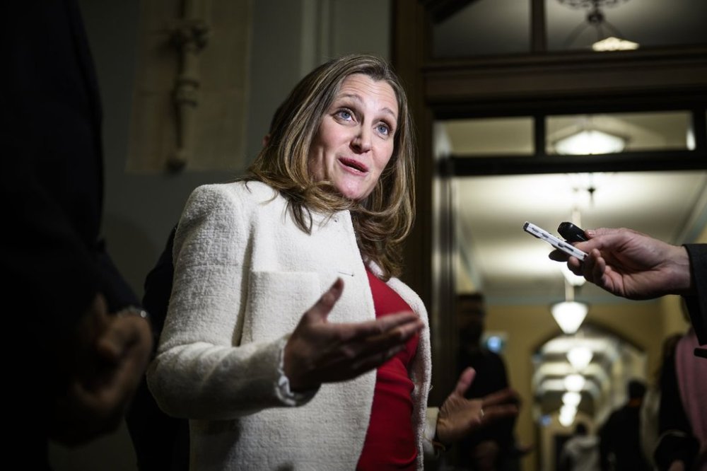 Liberal leadership candidate Chrystia Freeland answers questions from journalists as she makes her way to a meeting of the Liberal caucus, in West Block on Parliament Hill in Ottawa, on Thursday, Jan. 23, 2025. THE CANADIAN PRESS/Justin Tang