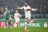 Stuttgart's Deniz Undav celebrates after scoring the opening goal during the German soccer cup, DFB Pokal, quarter final soccer match between VfB Stuttgart and FC Augsburg in Stuttgart, Germany, Tuesday, Feb. 4, 2025. (Tom Weller/dpa via AP)