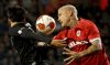 FILE - Frankfurt's Daichi Kamada, left, goes up against Royal Antwerp's Radja Nainggolan during the Europa League group D soccer match between Royal Antwerp and Frankfurt at the Bosuil Stadium in Deurne, Belgium, Sept. 30, 2021. (AP Photo/Olivier Matthys, File)