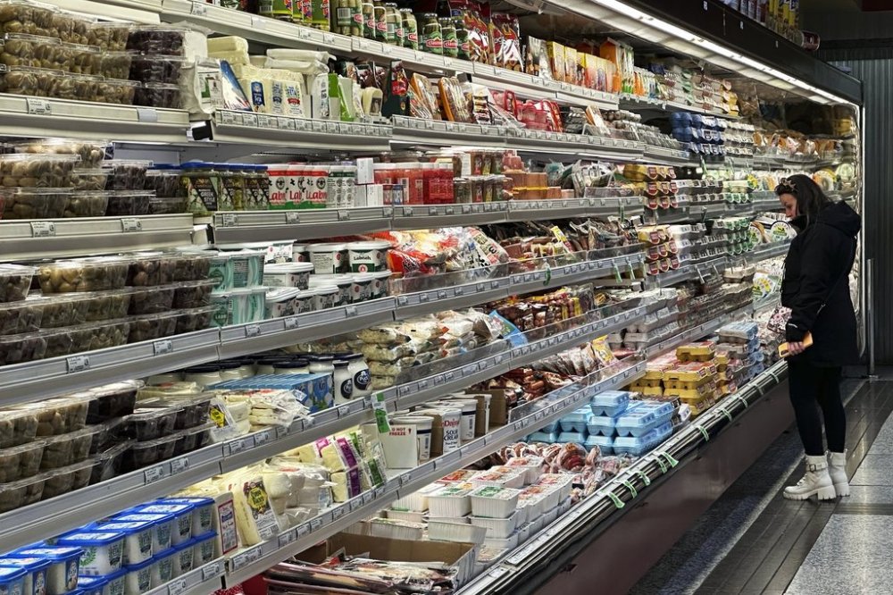 As the price of just about everything has risen over the past few years, Canadians looking to rein in their spending usually turn to discretionary costs first. A customer shops at a grocery store in Wheeling, Ill., Wednesday, Dec. 11, 2024. THE CANADIAN PRESS/AP/Nam Y. Huh