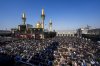 Shiite pilgrims pray at the golden twin-domed shrine of Imam Moussa al-Kadhimduring during their annual pilgrimage in the northwestern Baghdad district of al-Kadhimiyah, Iraq, Saturday Jan. 25, 2025. (AP Photto/Anmar Khalil)