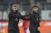 AC Milan's Santiago Gimenez, left, speaks with AC Milan's Joao Felix during warm up before an Italian Cup quarterfinal soccer match between AC Milan and Roma at the San Siro stadium, in Milan, Italy, Wednesday, Feb. 5, 2025. (AP Photo/Antonio Calanni)