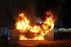 A fire at a nearby merchandise kiosk outside the Etihad Stadium stadium before the Champions League opening phase soccer match between Manchester City and Brugge in Manchester, England, Wednesday, Jan. 29, 2025. (Martin Rickett/PA via AP)
