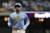 FILE - Milwaukee Brewers' William Contreras jogs to the dugout during the seventh inning of a baseball game against the New York Mets, Friday, Sept. 27, 2024, in Milwaukee. (AP Photo/Aaron Gash, File)