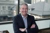 FILE - In this Jan. 31, 2018, photo, Rob Cohen, who is spearheading Colorado's effort to secure an Olympic bid, poses in his office in lower downtown Denver. (AP Photo/David Zalubowski, File)