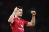 Manchester United's Harry Maguire celebrates after the English FA Cup fourth round soccer match between Manchester United and Leicester City at the Old Trafford stadium in Manchester, England, Friday, Feb. 7, 2025. (AP Photo/Dave Thompson)