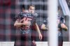Munich's Harry Kane, center, celebrates scoring during the Bundesliga soccer match between SC Freiburg and Bayern Munich at Europa-Park Stadium, Freiburg, Germany, Saturday Jan. 25, 2025. (Tom Weller/dpa via AP)