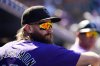 FILE - Colorado Rockies' Charlie Blackmon watches from the dugout railing during the first inning of a baseball game against the St. Louis Cardinals, Thursday, Sept. 26, 2024, in Denver. (AP Photo/David Zalubowski, File)