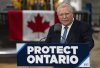 Progressive Conservative Leader Doug Ford speaks from the podium during a visit to Walker Construction in St. Catharines, Ont. on Friday, Jan. 31, 2025. THE CANADIAN PRESS/Peter Power