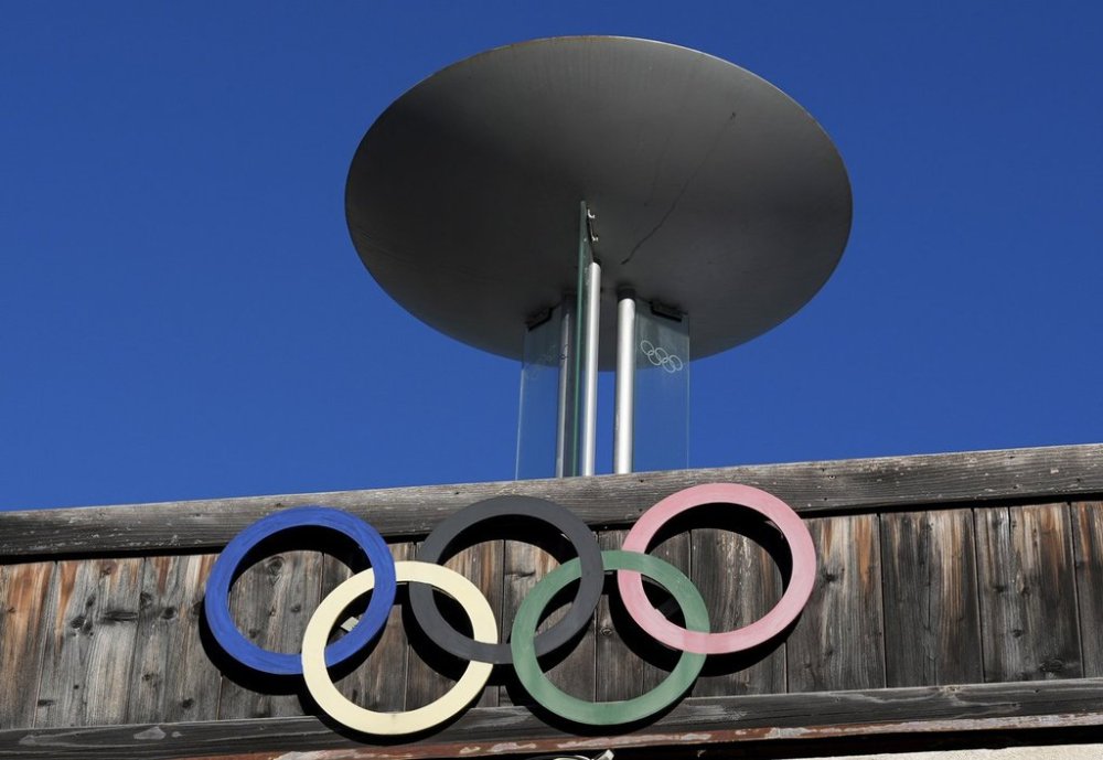 The Olympic rings adorn the Stadio Olimpico del Ghiaccio, which will be called Cortina Curling Olympic Stadium, venue for the curling discipline at the Milan Cortina 2026 Winter Olympics, in Cortina d'Ampezzo, Italy, Thursday, Jan. 16, 2025. (AP Photo/Giovanni Auletta)