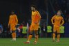 Real Madrid's Jude Bellingham, centre and Luka Modric, right, react after Espanyol's Carlos Romero scored the opening goal during a Spanish La Liga soccer match between Espanyol and Real Madrid at the Lluis Companys Olympic Stadium in Barcelona, Spain, Saturday Feb.1, 2025. (AP Photo/Joan Monfort)
